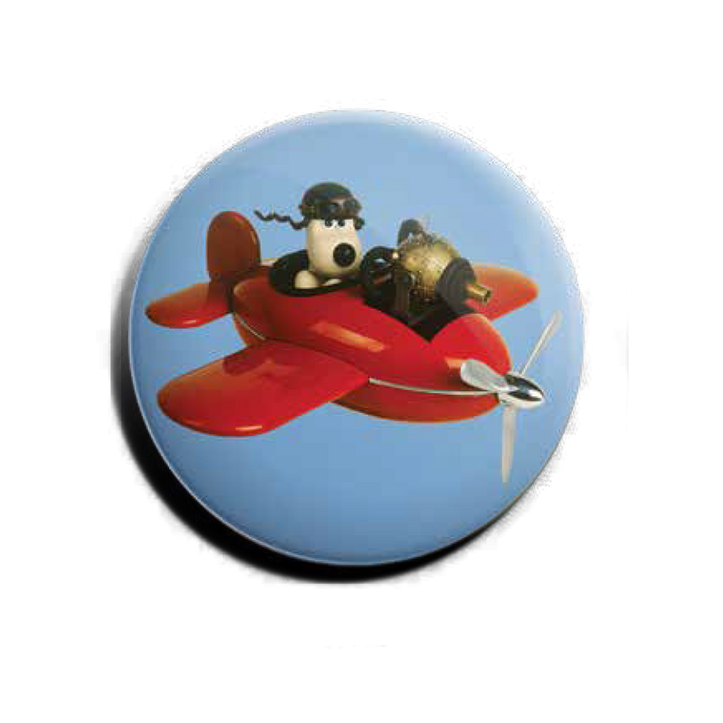 Blue badge featuring Aardman's Gromit in a red plane 