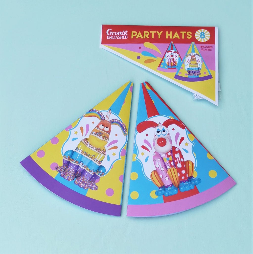 Eight party hats featuring Giggles and Sprinkles figurines from the Gromit Unleashed trails. 