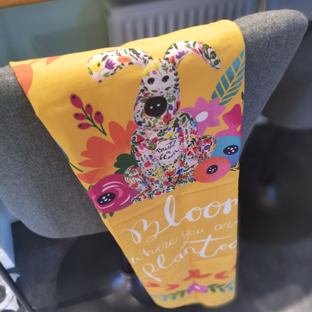 Blossom Gromit Unleashed tea towel. Reads 'Bloom where you are planted'.  