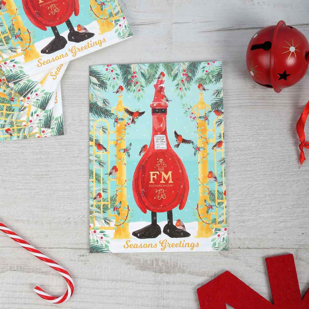 Postie McGraw Christmas card pack on a wooden background