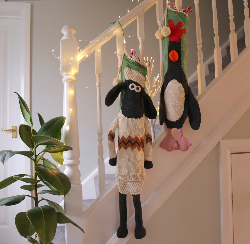 Shaun the Sheep and Feathers McGraw Christmas Stocking with a festive jumper 