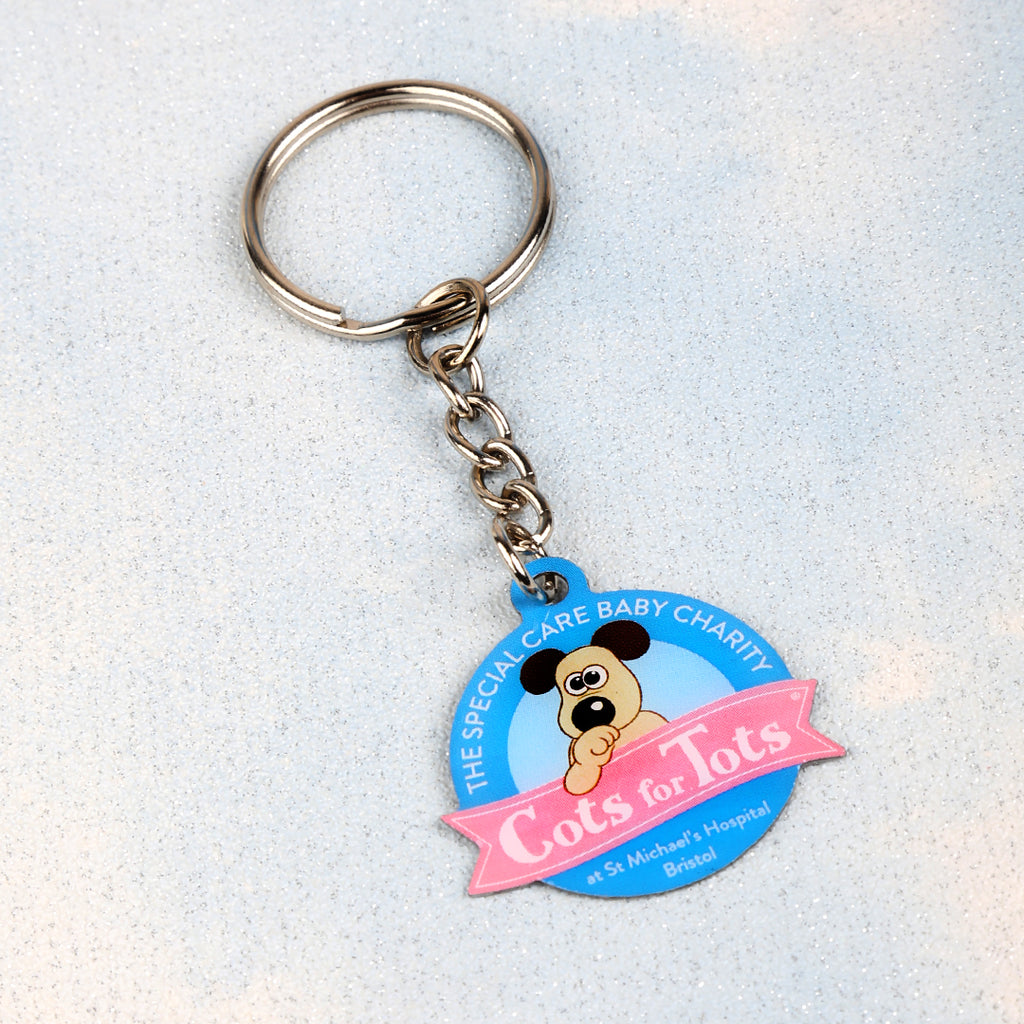 The Special Care Baby Charity at St Michael's Hospital Bristol Cots for Tots circular keyring featuring a baby Gromit