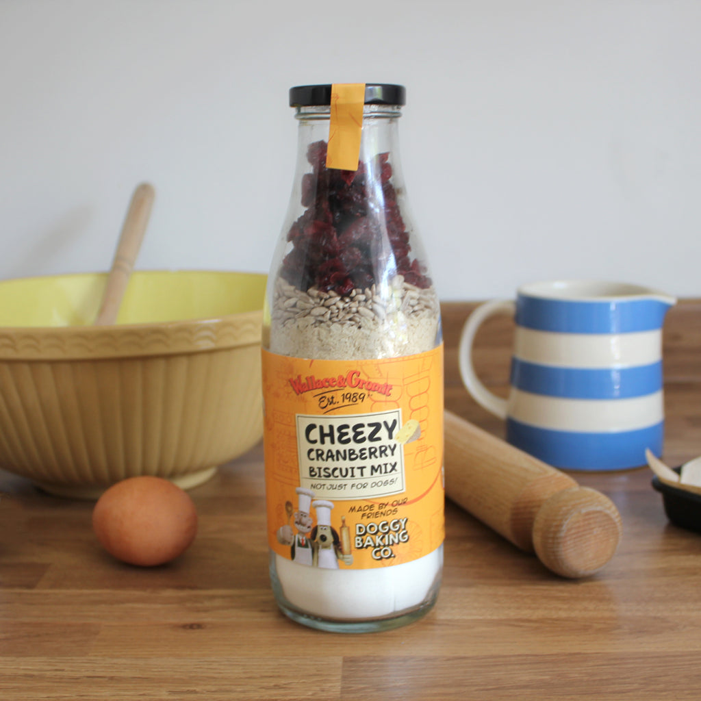 Wallace & Gromit Cheezy Cranberry and Sunflower Seed Biscuit Bottled Baking Mix! This savoury duo is a unique blend of scrumptious flavours to make biscuits for yourself AND your doggie too. 