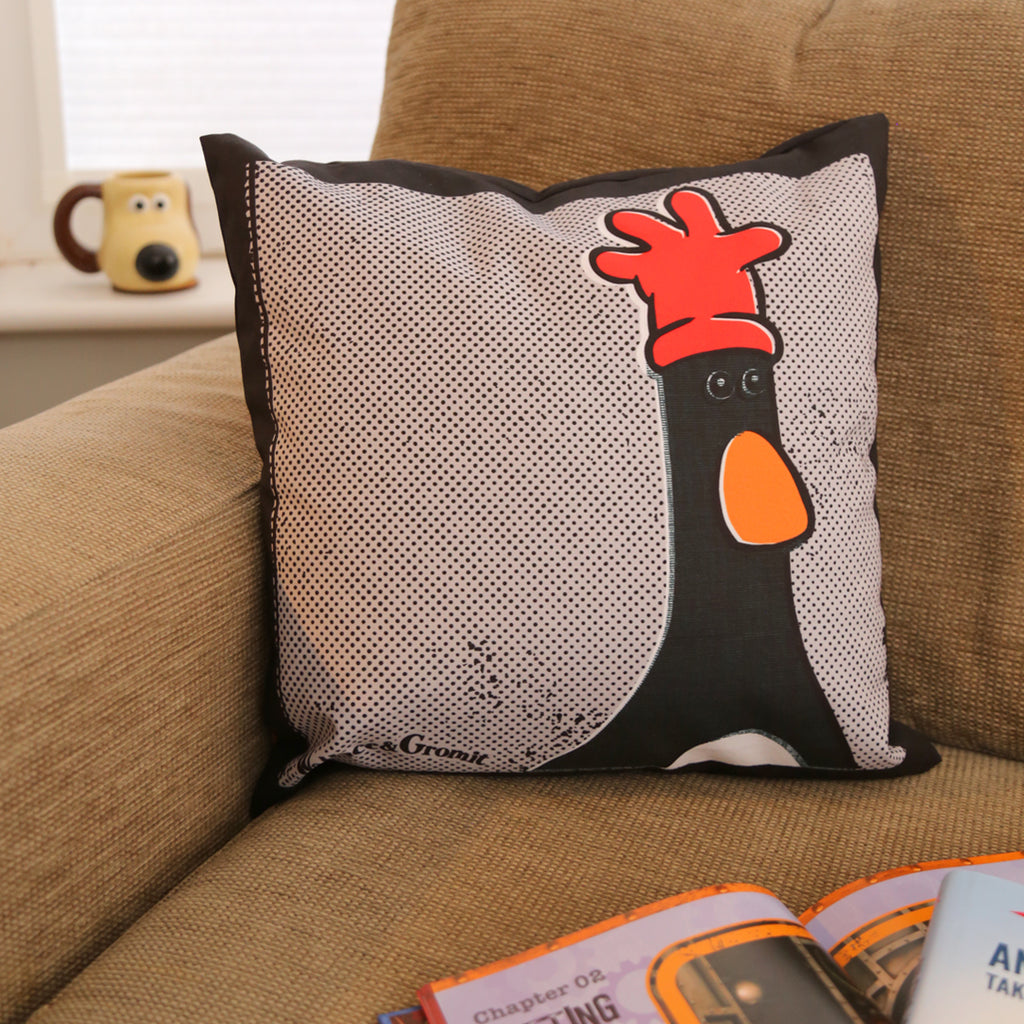 One pillow, showing both the back and front designs with Feathers McGraw and the humorous text, 'Have you seen this chicken?'