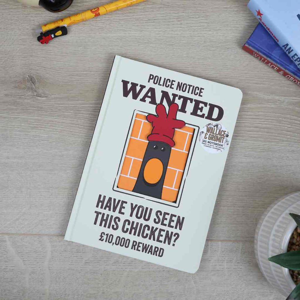 Notebook with a 'Wanted' poster design featuring a chicken on a wooden surface.