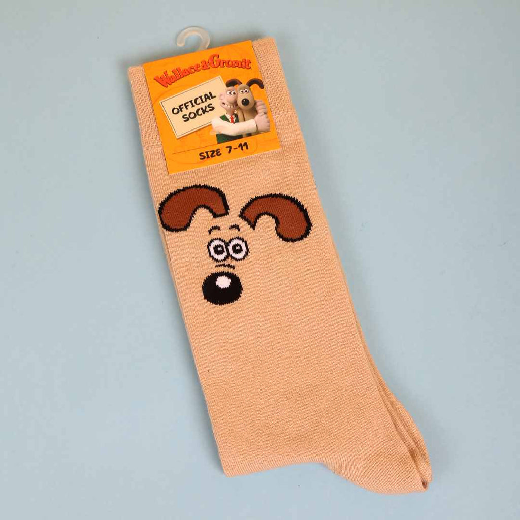 Beige sock with Gromit's face design on a light blue background