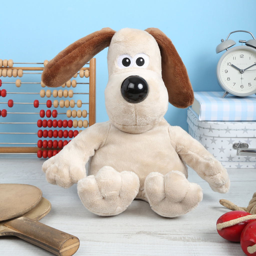 Gromit Microwavable Plush Toy with a wooden abacus and clock in the background