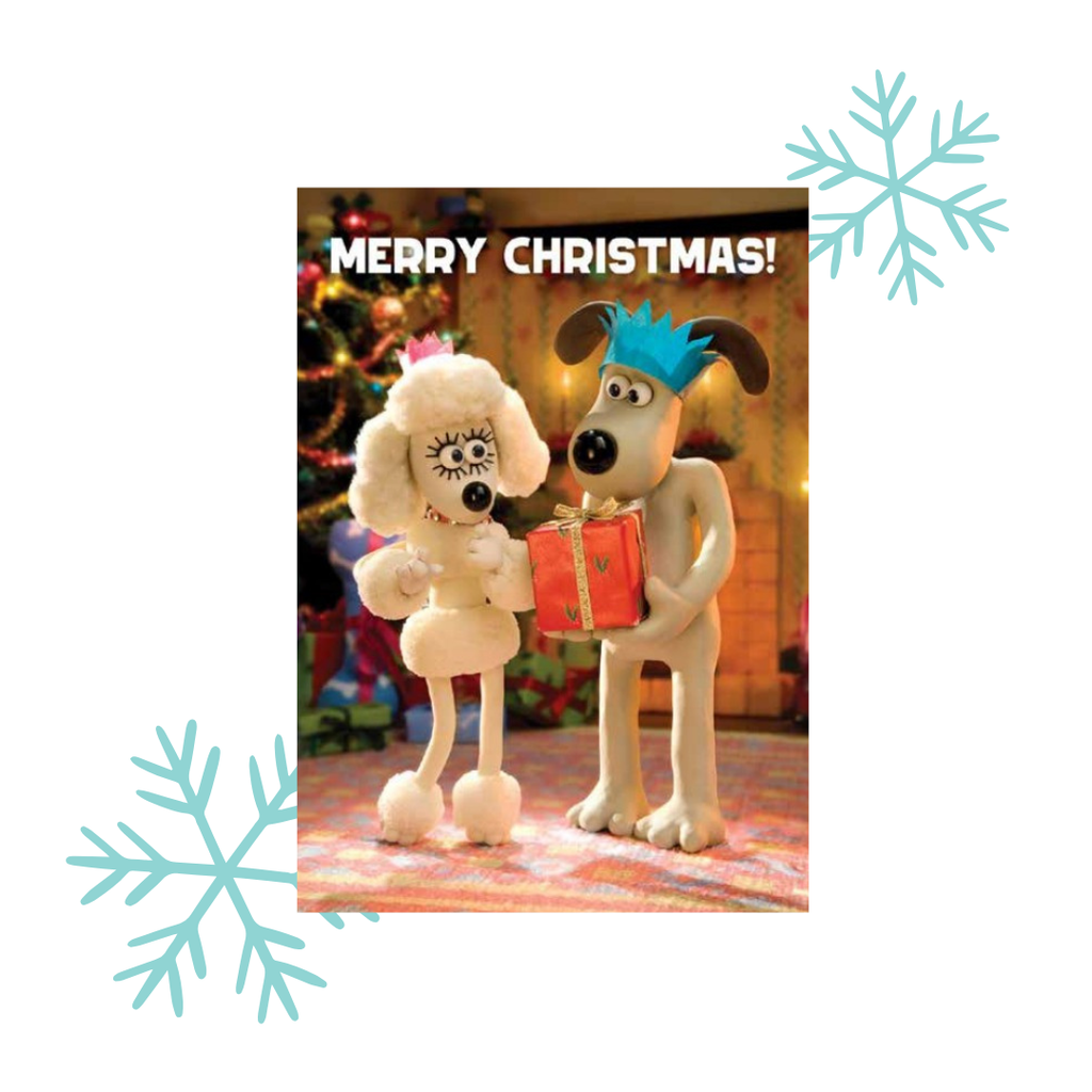 Flupple and Gromit holding a gift with 'Merry Christmas!' text, surrounded by snowflakes.