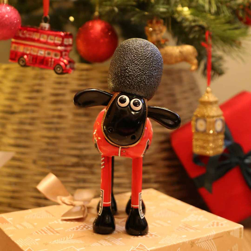 The Guardian Shaun the Sheep Figurine in a festive backdrop