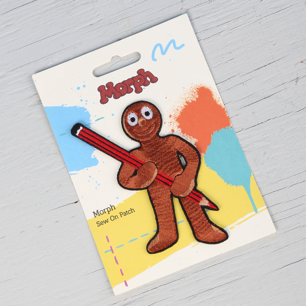 Morph holding a pencil sew on badge. 
