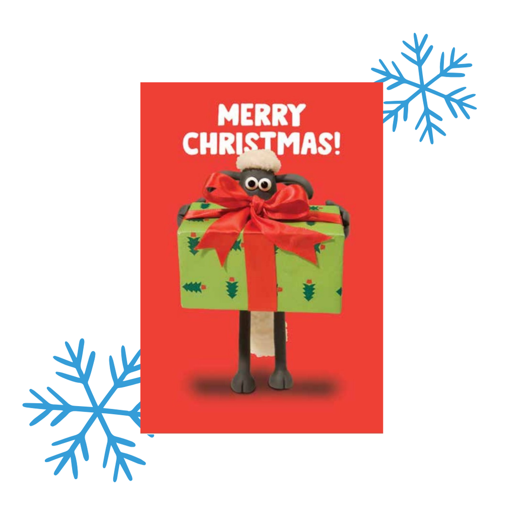 Christmas card with Shaun the Sheep with a large green gift box on a red background with 'Merry Christmas!' text.