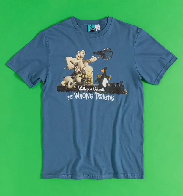 Blue t-shirt featuring the classic chase scene from Aardman's film Wallace & Gromit's: The Wrong Trousers. Features Wallace, Gromit and Feathers McGraw on a toy train, Wallace trying to catch Feathers with a net. 