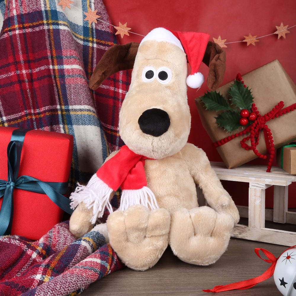 Gromit in a santa Father Christmas hat and scarf  