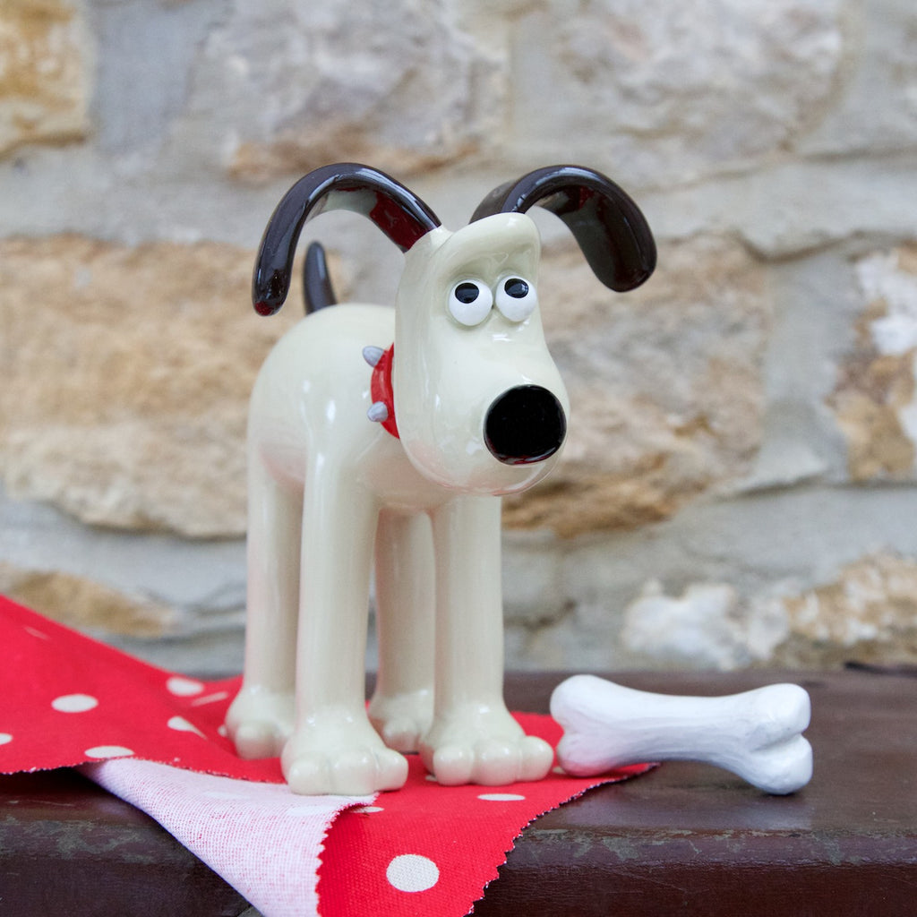 Classic Gromit Figurine pictured with small bone