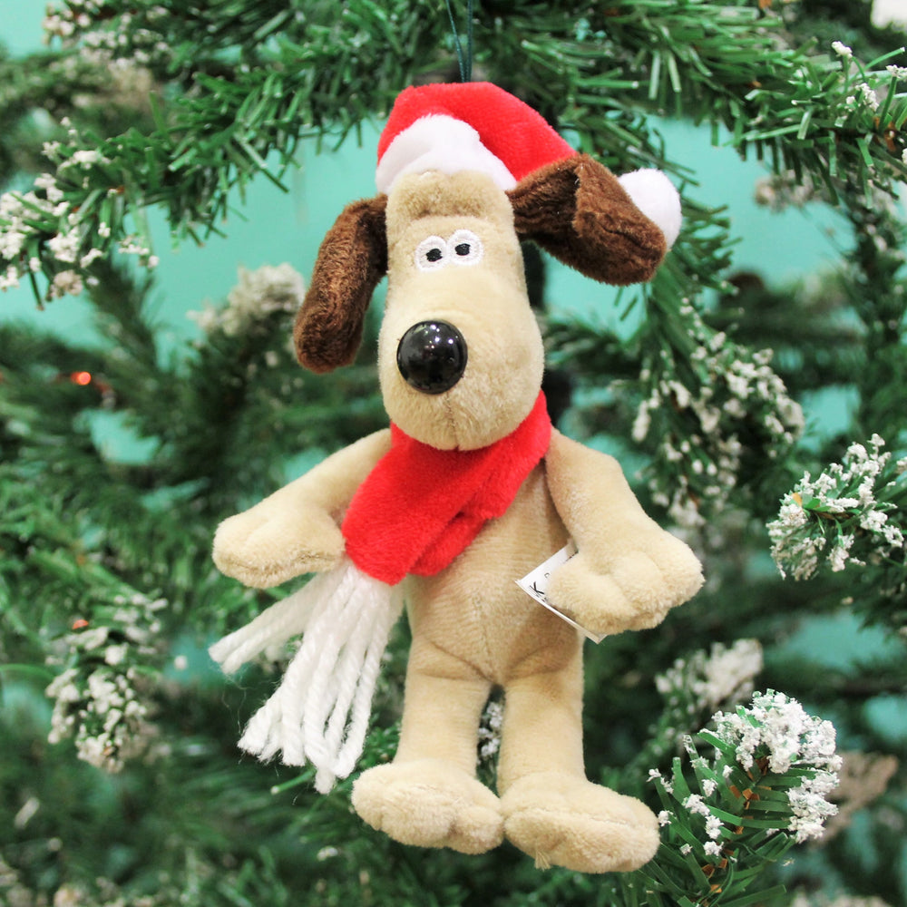 Soft toy Gromit with red scarf and santa hat