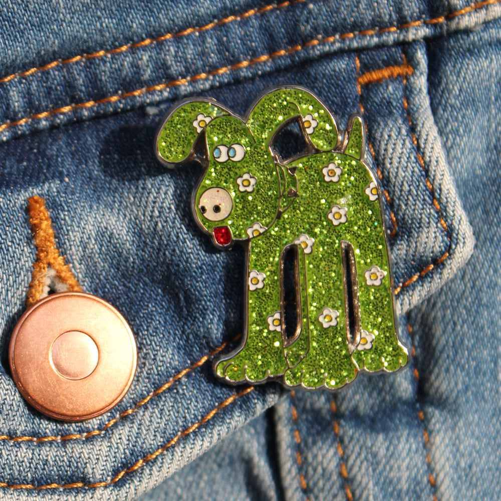 Gromit pin badge, green and covered in daisies
